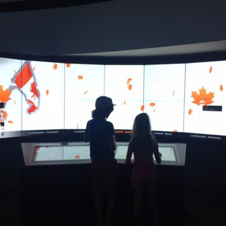 2 kids look at an exhibit at canadian history hall